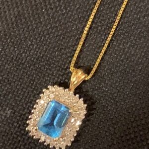 Gold Necklace with Blue Gemstone Pendant